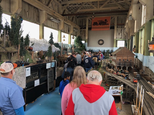A crowd visiting the layout - a familiar scene
